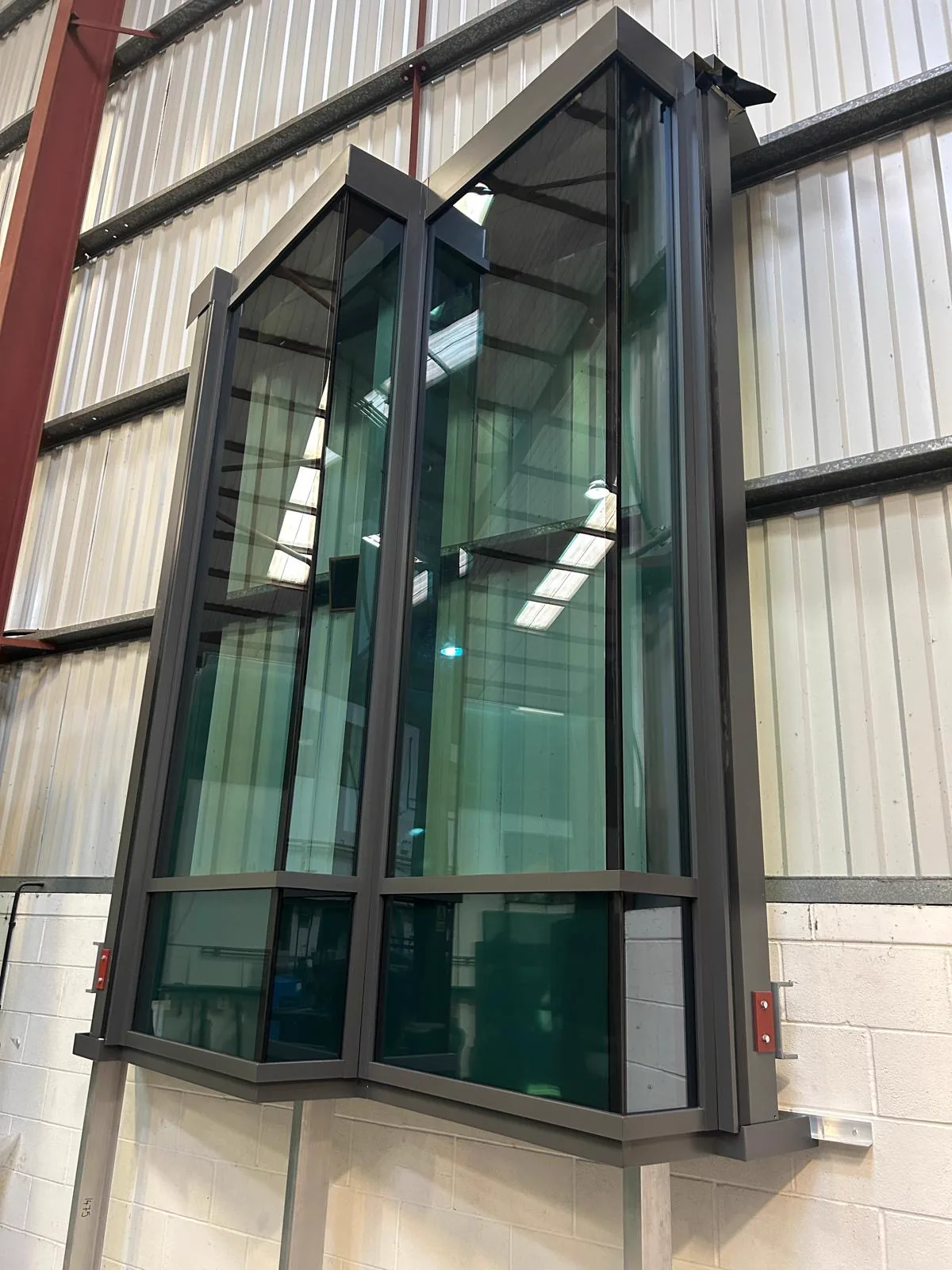 In-house MBE glazed aluminium frame assembly
